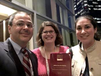 Curtis Amann, Vice President of Corporate Partner Relations, with educational technology's Anna Smith and Melissa Freund.