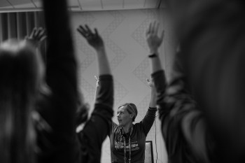 Amy Martin leads exercises at the 2019 company meeting.